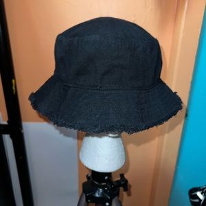 Lightly worn black bucket hat